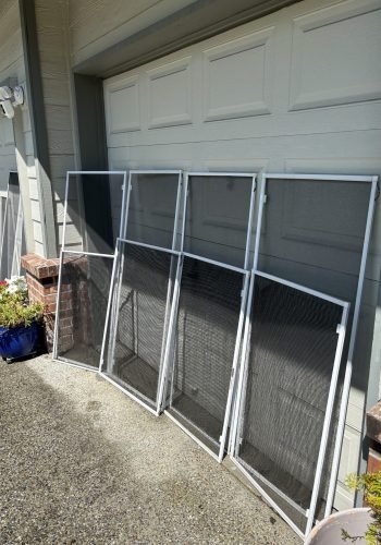 Clean window screens drying outside